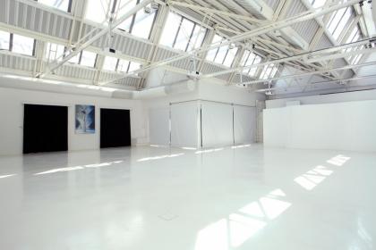 White-washed, multipurpose space in Bicocca, Milan